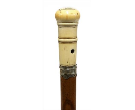 A turned ivory pomander walking stick, 18th century, the handle with a screw-off lid and pierced holes, the silver mount with