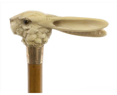 A carved ivory hare's mask walking stick , late 19th century, the 9ct gold mount with initials/monogram and glass eyes, on a 