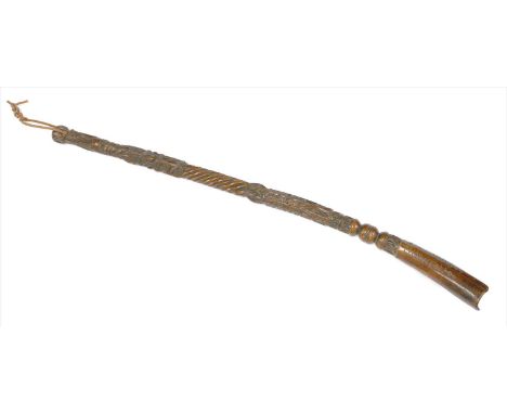 A Welsh yew wood basting stick, dated 1677, with a profusely chip carved and spiral turned handle and a curved trough, carved