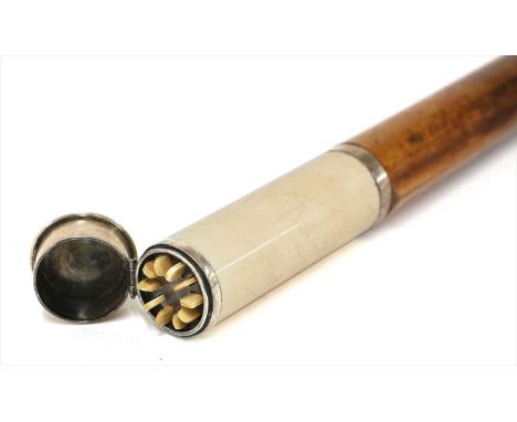 An ivory and metal butt marker walking stick, 1920s, the handle in the form of a cartridge, containing ten numbered sticks, o