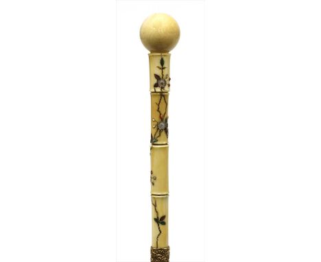 A carved ivory Shibayama walking stick , late 19th century, the turned handle with a ball finial, the shaft inlaid with folia