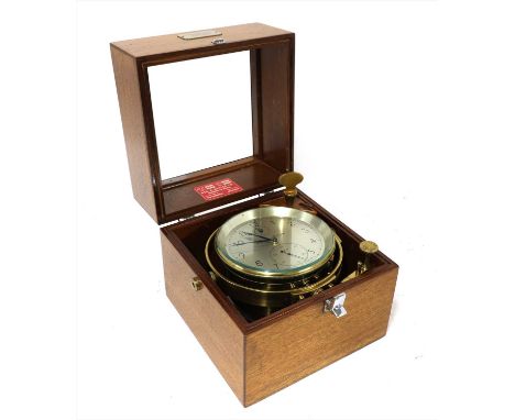 An eight-day marine chronometer, by Thomas Mercer Ltd., St Albans, No. 912N, with a 4 ½ in dial, labelled 'Geo. E. Butler Co.
