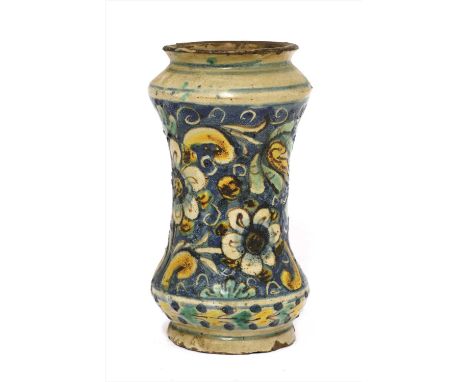 A Sicilian Caltagirone albarello, 17th century, of waisted cylindrical form, the tin glaze painted with flowers and leaves, 2
