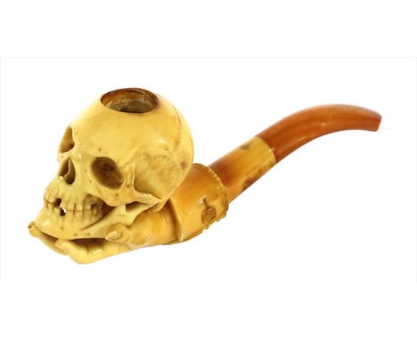 A large antique meerschaum pipe, with the bowl in the form of a skull held in a hand with cuff, in original case by Carl Wern