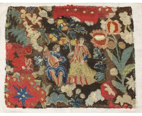 A wool work panel , 18th century, depicting two figures in a garden, the man playing the lute, unframed and linen backed, 40 