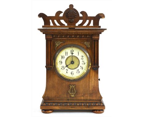 A Junghans walnut cased musical mantel clock, late 19th century, the central dial with off-white chapter ring with Arabic num
