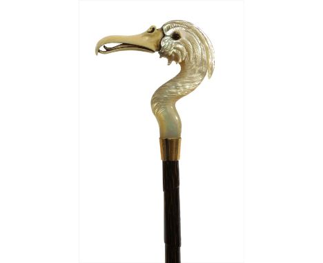 A Victorian carved mother-of-pearl flamingo's head parasol , with ivory beak and glass eyes, the fabric shredded, 92.5cm long