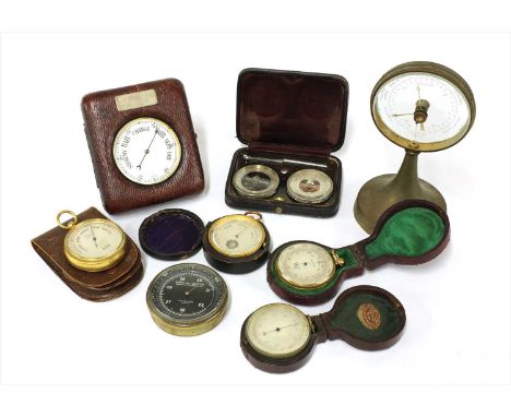 Seven aneroid barometers and an auto-altimeter , the first a desk model, pocket watch style in leather case, the second with 