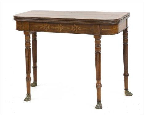 A George IV mahogany and rosewood crossbanded card table, the fold-over top with diamond line inlay to the frieze, over turne