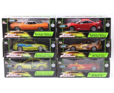 A collection of Joyride and Racing Champions 1/18 scale The Fast and Furious boxed diecast group to include a 1994 Mazda RX7,