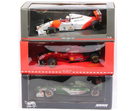 Minichamps and Hot Wheels 1/18th scale diecast Formula 1 group of 3 comprising a Minichamps Michael Schumacher Collection Fer