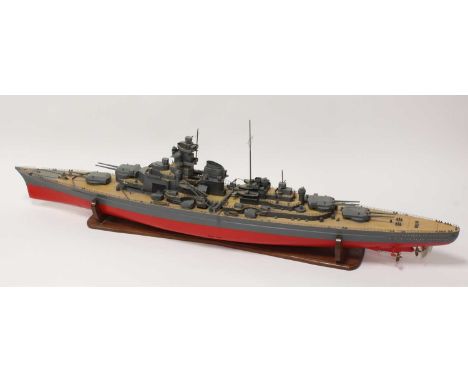 A very large kit built radio-controlled model of a KM Bismarck Battleship, comprising of GRP hull with wooden superstructure,