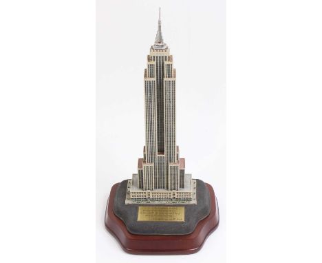 A Danbury Mint scale model of the Empire State building, housed in the original polystyrene packed box