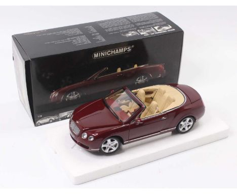 A Minichamps 1/18 scale model of a Bentley Continental GTC 2006 saloon, finished in metallic red, model No. 139030