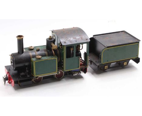 A 32mm scale radio controlled and gas powered locomotive and tender, comprising of 0-4-0 tank loco in green with yellow linin