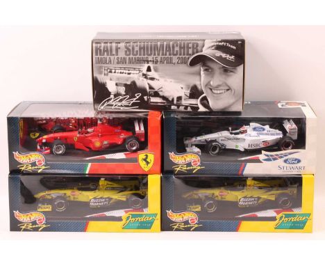 A Hotwheels 1/18 scale boxed Formula One race car group, to include a Ralf Schumacher Imola/San Marino 2001 race car, a 1999 