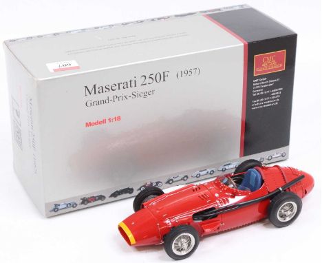 A CMC Exclusive Models No. M-051 1/18 scale model of a Maserati 250F 1957 Grand Prix Sieger race car, finished in red and hou