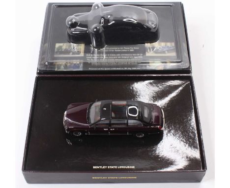 A Minichamps 1/43 scale boxed model of a Bentley State Limousine finished in metallic maroon, housed in the original Bentley 