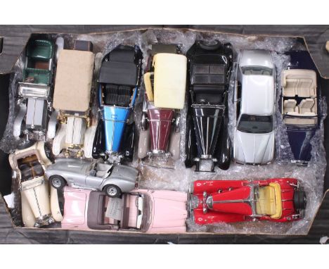 A collection of 10 various Franklin Mint 1/18th scale diecast vehicles, with examples including a Mercedes Benz 500K Roadster