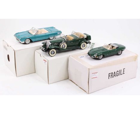 A collection of three Danbury Mint 1/24 scale boxed diecast vehicles to include a 1961 Ford Thunderbird, a 1961 Jaguar E-type