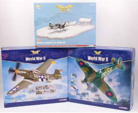 Three various boxed Corgi Aviation Archive 1/32 and 1/76 scale aircraft, three various examples to include WWII in winter, J-