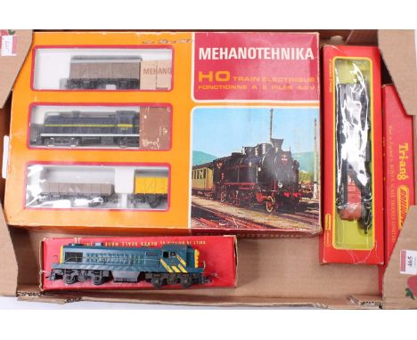 Tray containing four ‘non-British’ model railway items: Mehanotehnika goods train set comprising SNCF Bo-Bo diesel loco with 