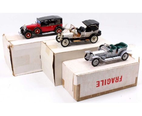 A collection of three various boxed Franklin Mint 1/24 scale diecast vehicles, including a 1912 Packard Victoria, a 1907 Roll