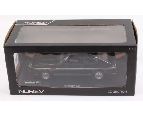 A Norev 1/18th scale No. 182716 Ford Capri 2.8i 1982 in black, the model has been on display as has one mirror missing