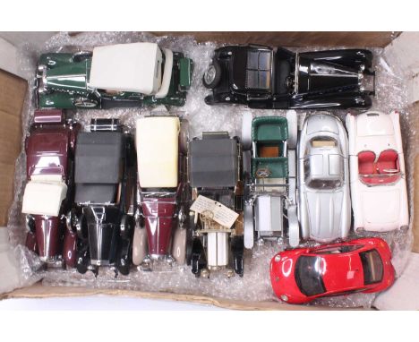 A collection of 10 various Franklin Mint 1/18th and 1/24th scale diecast vehicles, with examples including a Bugatti Royale N