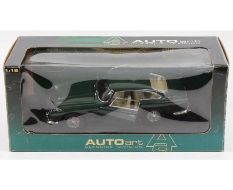 An Auto Art Classic Division 1/18 scale model of an Aston Martin DB5, finished in green, model No. 70023