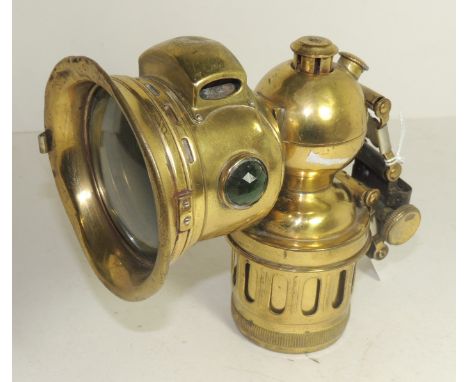 A Miller brass acetylene lamp with green faceted glass side panels, 15cms high