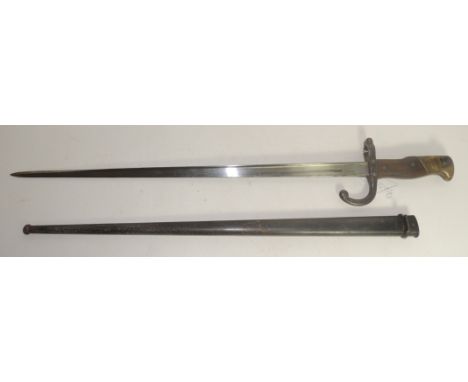 A French Gras bayonet the tapering straight blade with engraved back dated 1876, in metal scabbard, blade 52cms long