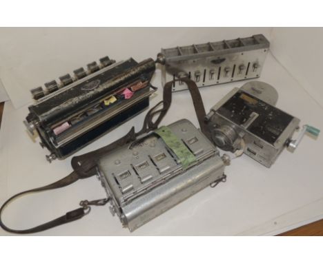A Bel Punch Ultimate bus ticket machine with original leather strap; a wall mounted Syro ticket machine; a Setright bus ticke