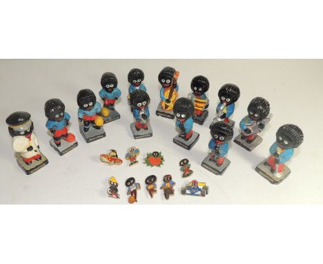 Robertson's Golly painted plaster figures: three footballers, Lollypop Golly and nine band members together with three enamel