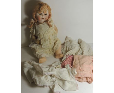 A William Goebel bisque socket head doll marked with crown over GW and B1-8 Germany with blond wig, sleeping eyes, open mouth