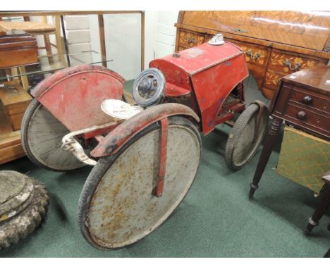 LINES BROS - a pedal Tractor of wood and metal construction, having rubber tyres, solid outer and spoked inner wheels (in nee