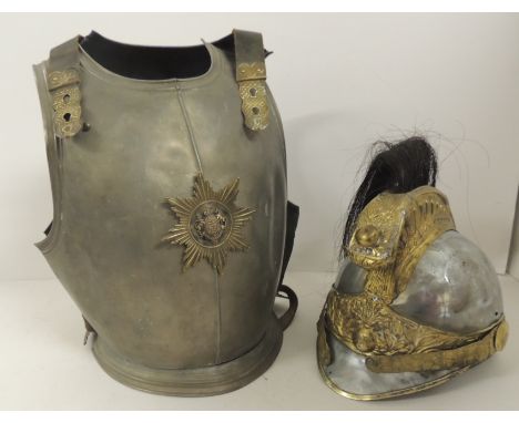 A small Cuirassier breastplate having leather shoulder straps and waist band and centred with badge to front together with Cu