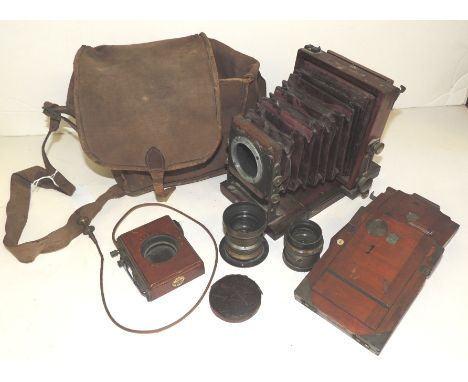 A Lancaster & Son folding camera in brass bound mahogany casing together with a Thornton Pickard shutter, a Ross lens, an un-