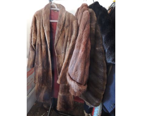 A ladies brown fur coat; a ladies brown fur jacket; a faux fur coat and a cape (4)
