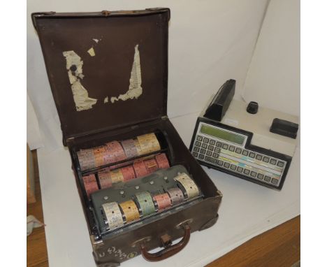 A bus ticket machine containing  a selection of tickets and together with a metal reel holder containing a selection of unuse