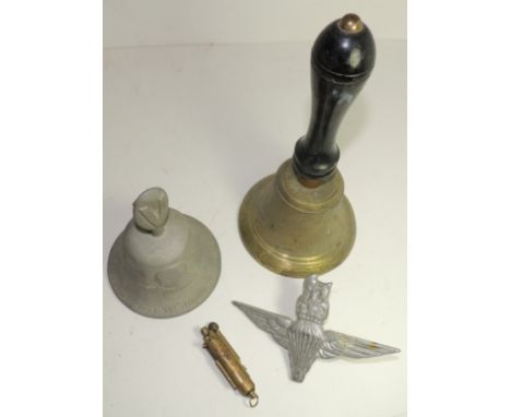 A WWII brass handbell with ebonised handle and marked "AS 1942" 27cms high; a WWII bell cast from metal from German Aircraft 