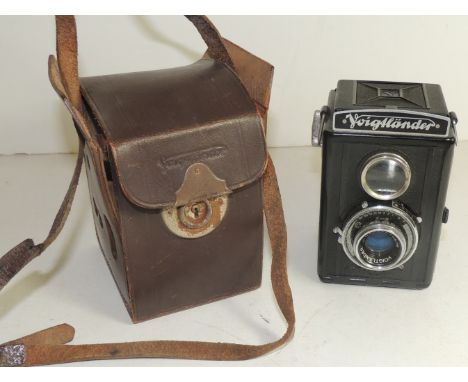 A Voigtlander Brillant box camera with Vaskar shutter, 1:4 5.75 lens and in original brown leather case 