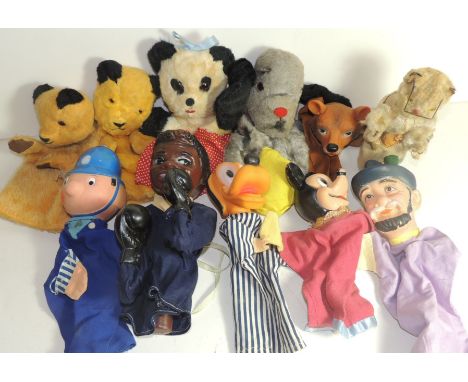 A collection of glove puppets including Chad Valley Soo, a Sooty and Sweep, Policeman, Bear, Mickey Mouse with moulded rubber