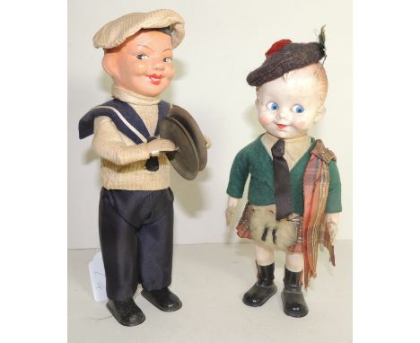 A West German made clockwork sailor doll toy, having painted composition head, card body, metal feet and hands, playing cymba