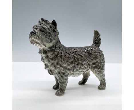 Glazed finish. Depicts a grey standing dog. Goebel backstamp. Issued: 20th centuryDimensions: 5.5''L x 2''W x 4.25''HManufact