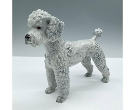 Glazed finish. Depicts a white standing dog with grey blue accents. Goebel backstamp. Marked 1968. Issued: 1968Dimensions: 7.