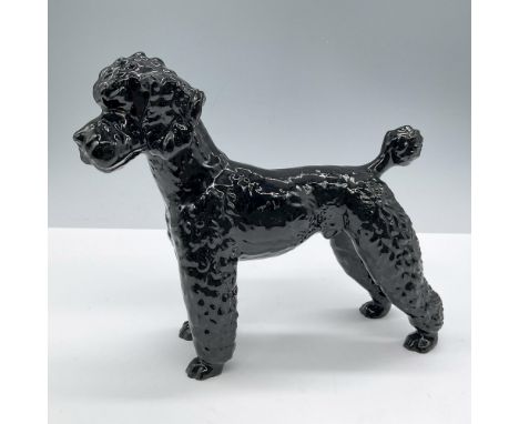 Glossy finish, depicts a black standing dog. Goebel backstamp. Issued: 20th centuryDimensions: 7.5''L x 2.5''W x 6.5''HManufa