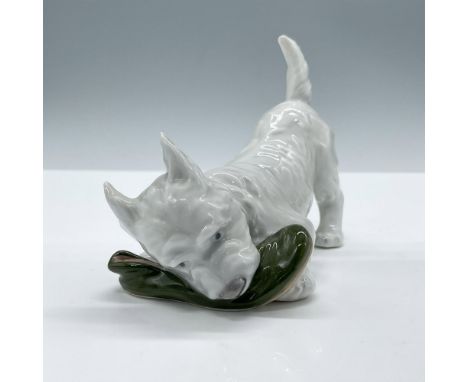 Glaze finish. Features a white terrier dog playing with a green slipper. Royal Copenhagen backstamp. Artist: Adda BonfilsIssu