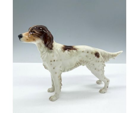 Glazed depiction of an standing white and brown dog. Goebel backstamp. Issued: 1968Dimensions: 9.5''L x 2.25''W x 6''HManufac