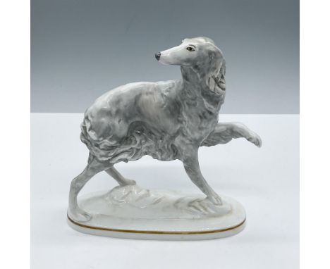 Elegant white and grey dog, standing on an oval base decorated with a gold rim. Marked Royal Worcester and signed my the arti